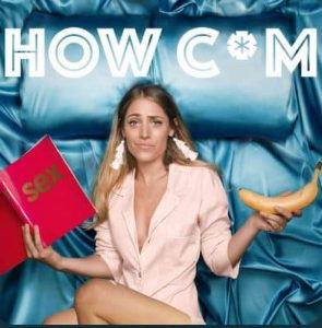 A woman sits on a blue satin bed holding a pink book labeled "sex" in one hand and a banana in the other, with "HOW C*M" written above her.