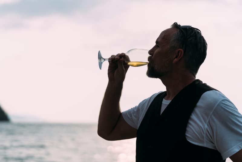 Man drinking wine glass.