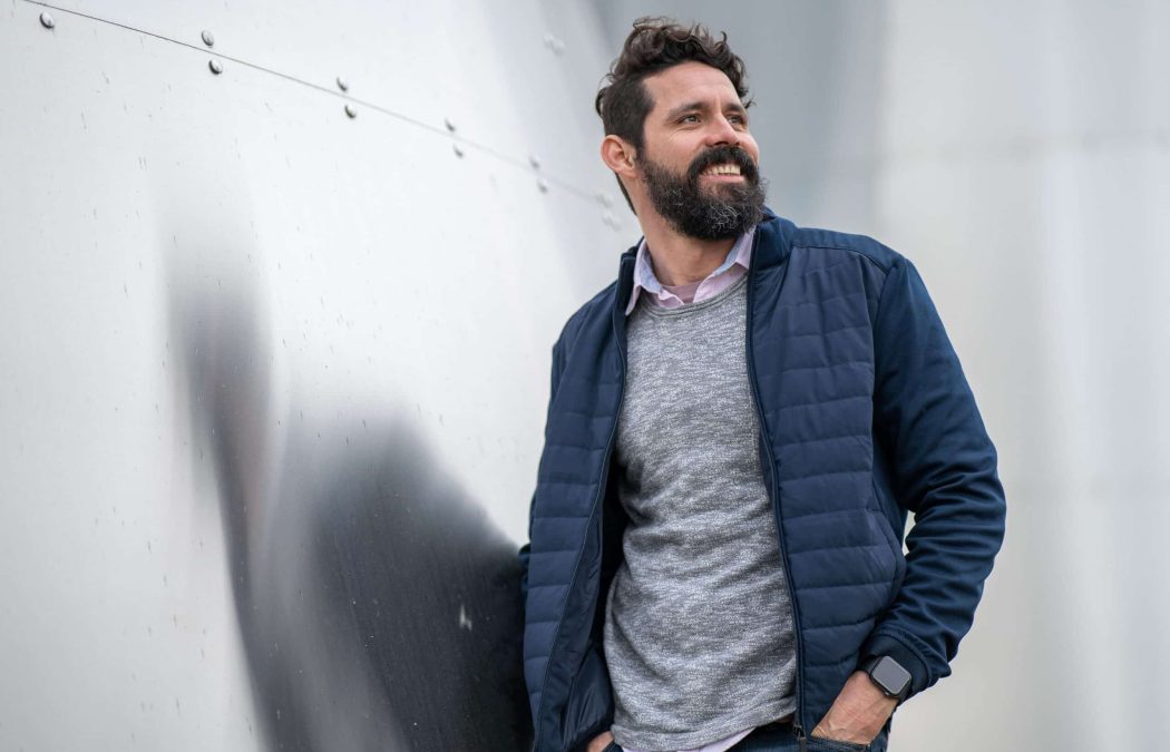 A man with a beard and dark hair