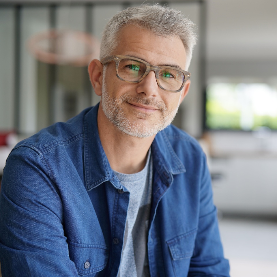 Middle-aged guy with eyeglasses and blue shirt