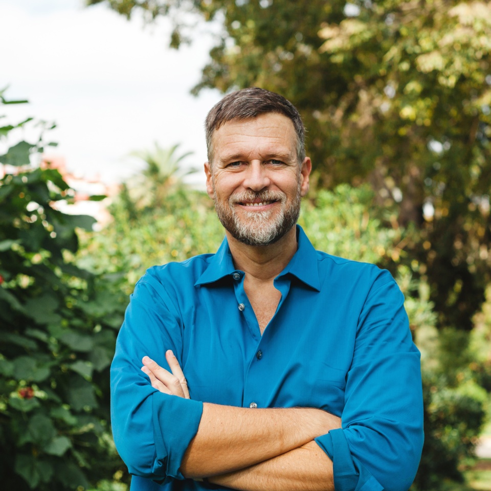 Portrait of Senior man caucasian smiling and looking at camera, outside in park.