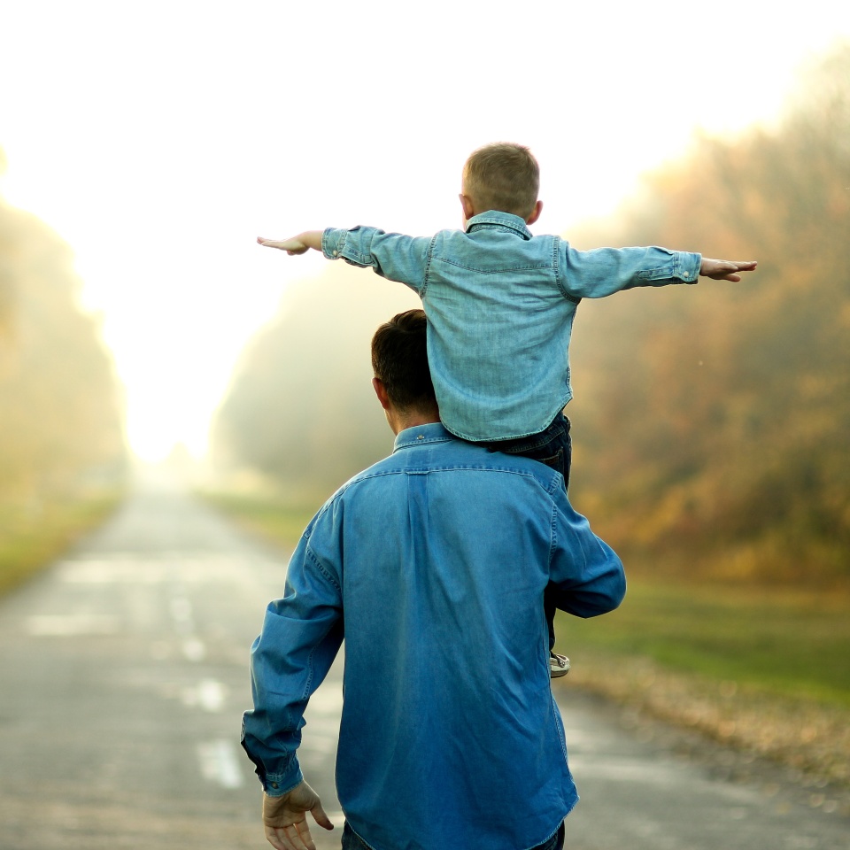 happy father and son walk in nature