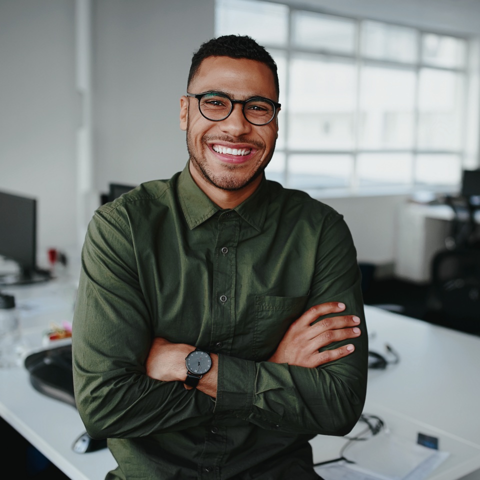 Portrait of young and successful businessman in modern office