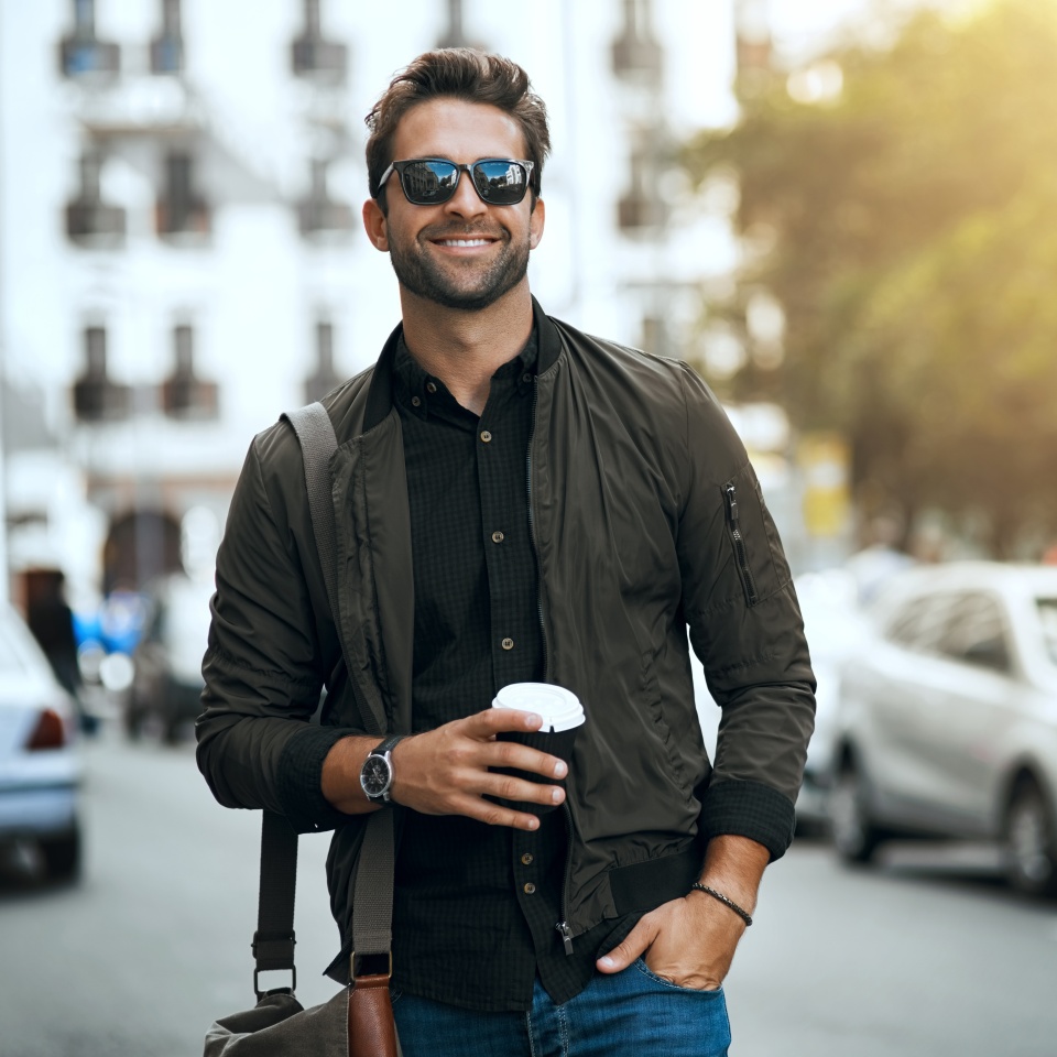 Cropped shot of a handsome young man traveling through the city.