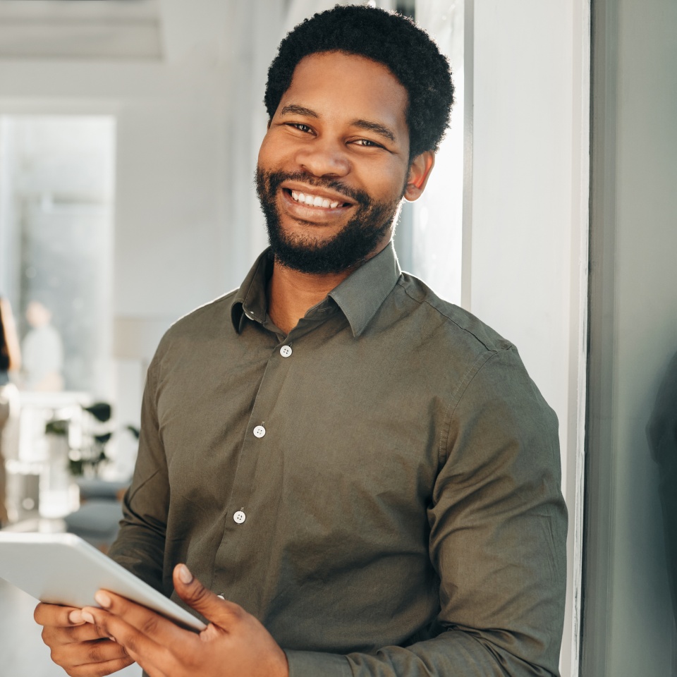 Portrait, digital tablet and black man in office happy, smile and empowered, ambition and mindset. Face and business man or ceo at startup company for management or online project at workplace.