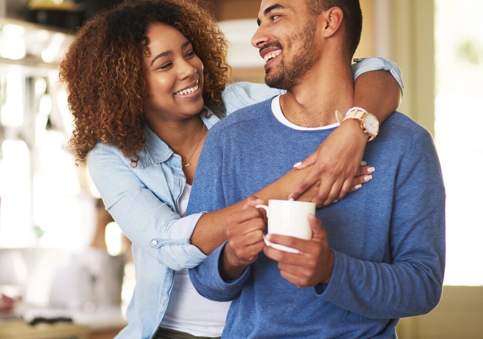 Shot of a happy young couple feeling relaxed in the at home.