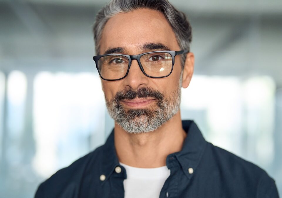 Happy middle aged professional business man, smiling mature executive ceo manager, 45 years old male entrepreneur, confident business owner wearing glasses in office. Headshot portrait.